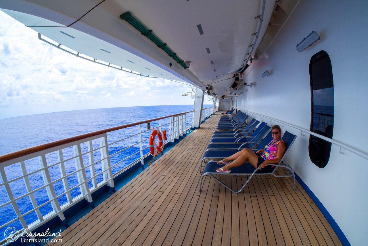 Relaxing in the shade underneath the lifeboats. I never could figure out why there weren’t more people here.