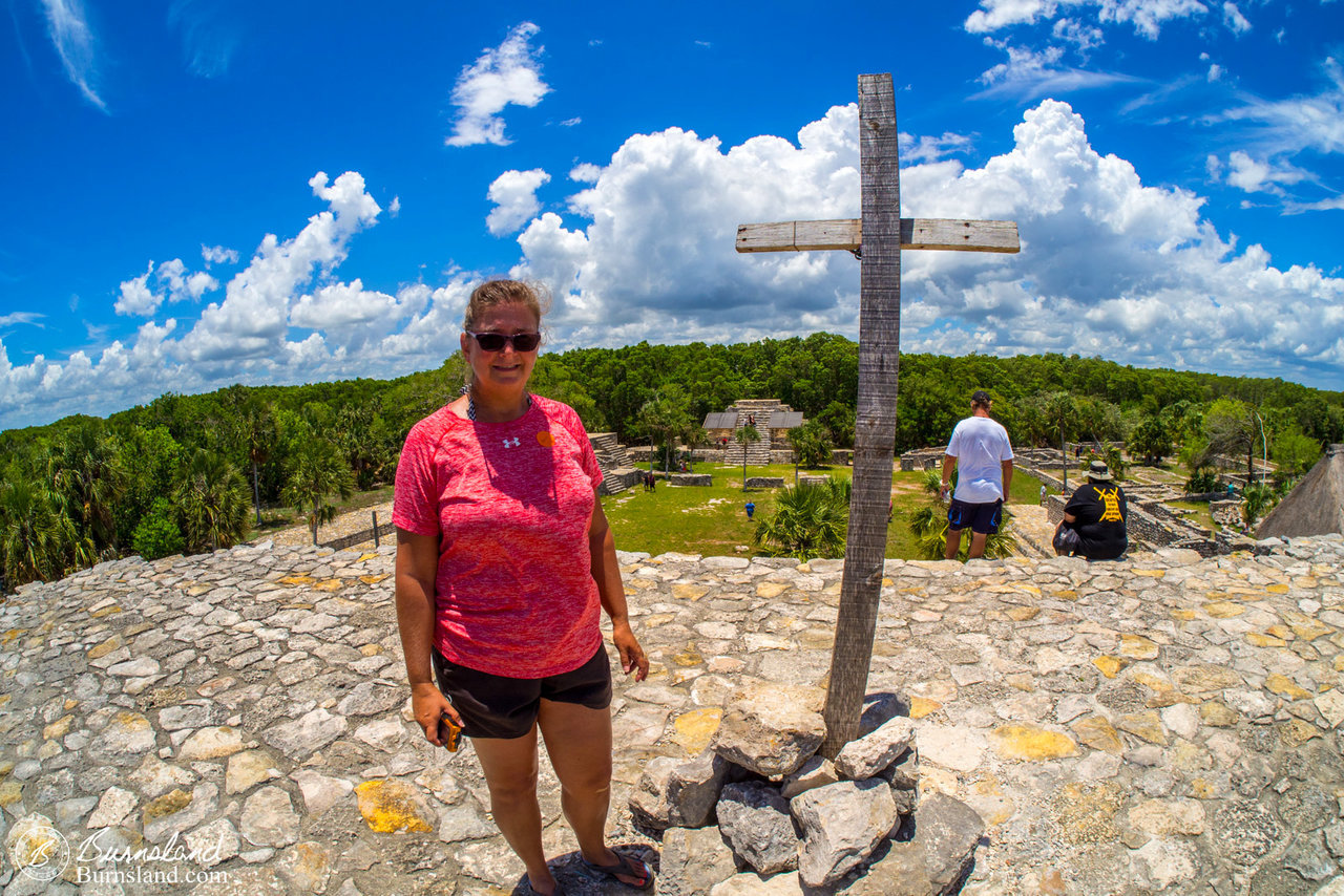 Laura stands next to the cross at the top of the largest structure.