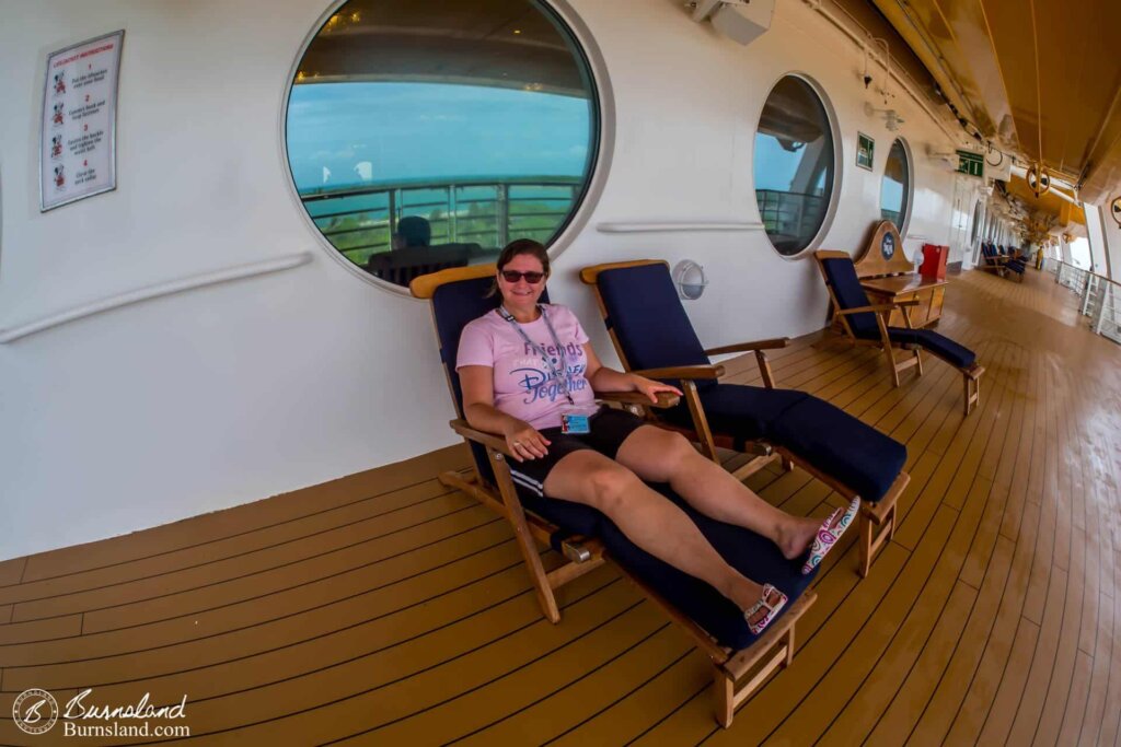 Laura relaxes in a deck chair.