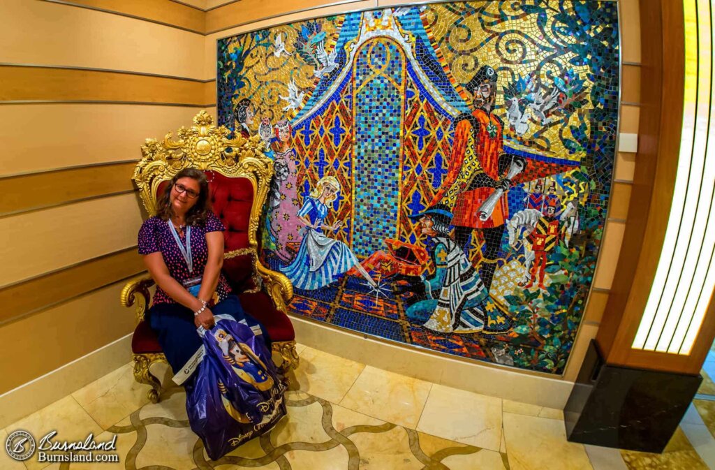 Laura enjoys a chair fit for a princess next to one of the Cinderella murals on the Disney Dream. This mural is a replica of one of the murals found in Cinderella Castle at Walt Disney World’s Magic Kingdom, by the way.