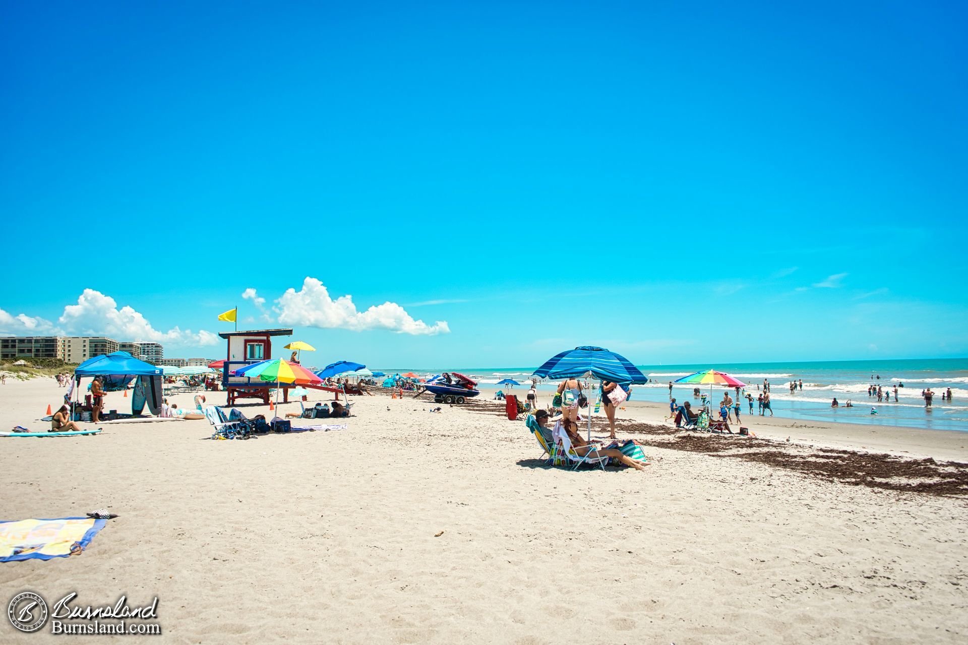 It was starting to look like a normal day at the beach, including the return of the yellow flag at the lifeguard hut.