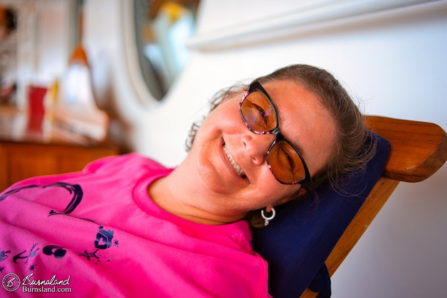 Lounging in a lounge chair on the Deck 4 Promenade of the Disney Fantasy