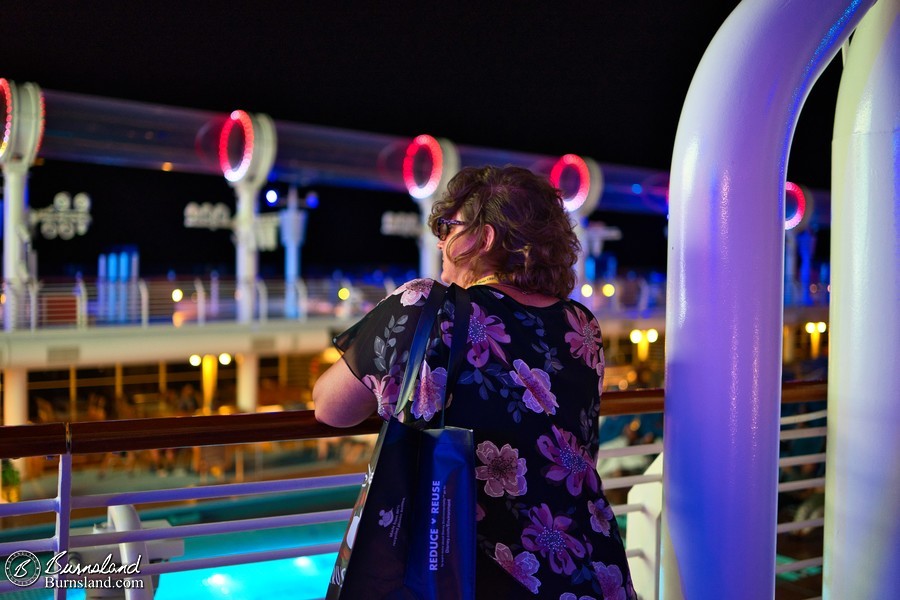 Laura watches a movie at night on the Disney Fantasy