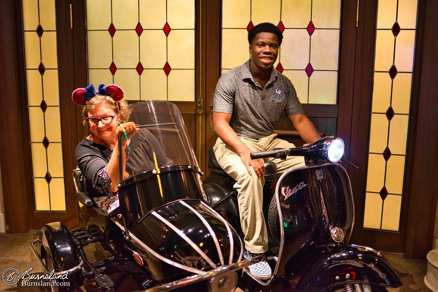 Laura and Jaylin with a Vespa