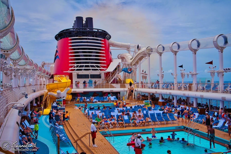 Passengers relax on the pool deck of the Disney Fantasy on a beautiful day at sea during our 2022 Disney Cruise.