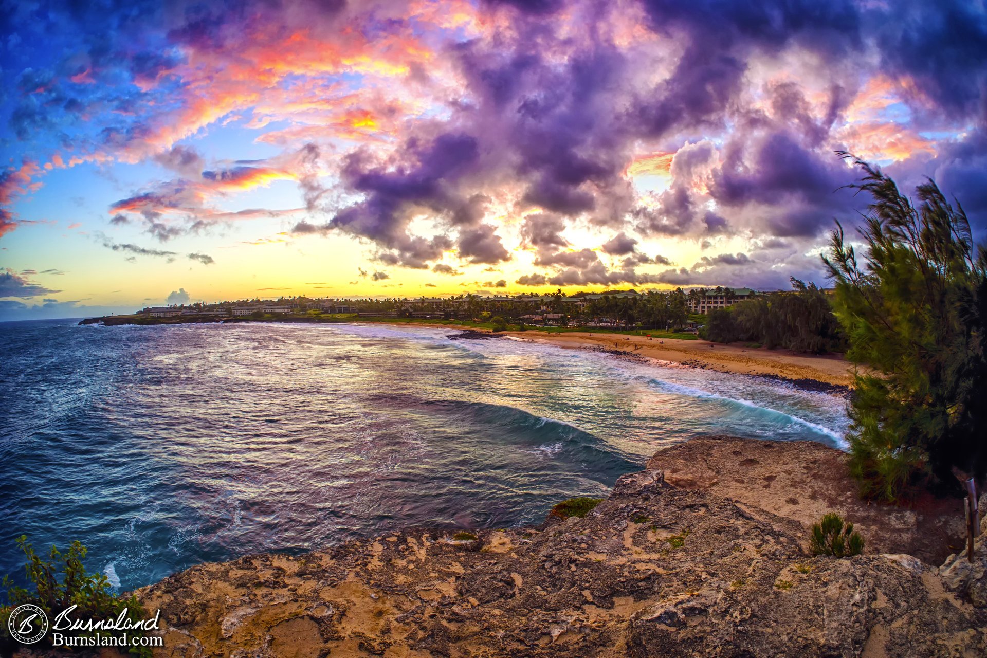 A beautiful, colorful beach sunset on the island of Kauaʻi in Hawaiʻi.