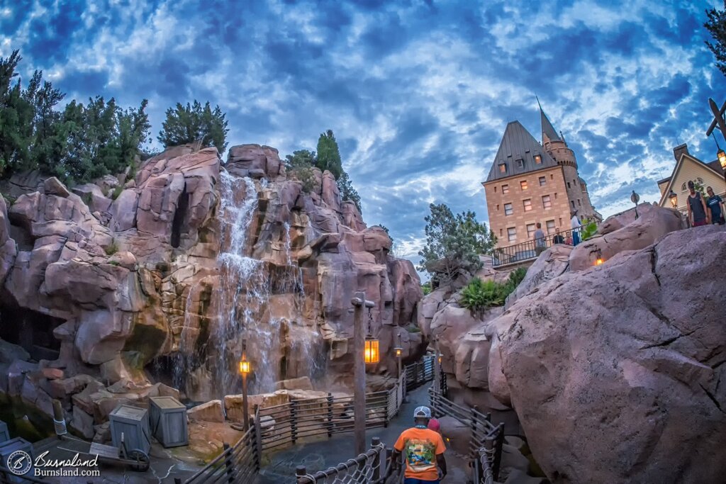 A waterfall flows near the Hotel du Canada in the early evening in Epcot’s World Showcase at Walt Disney World. Read all about it at Burnsland!