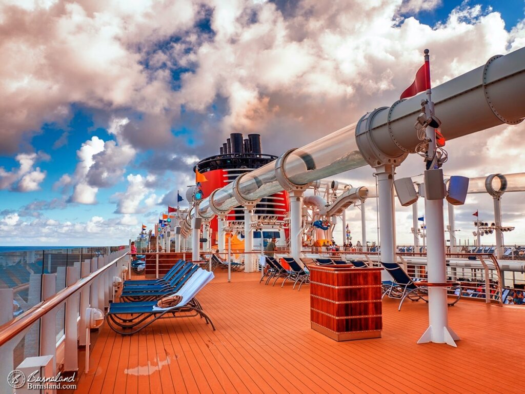 White clouds float in the sky above the deck of the Disney Dream, one of the Disney Cruise Line ships. Read all about it at Burnsland!