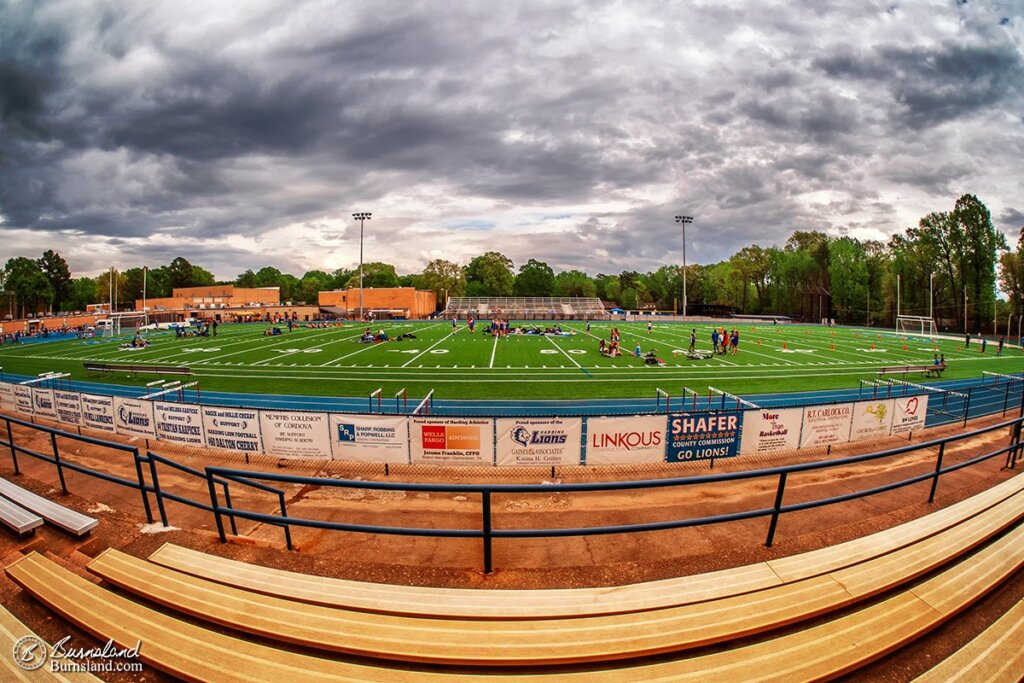 Clouds fill the sky above the field before a track meet starts at Harding Academy in Memphis, Tennessee. Read all about it at Burnsland!