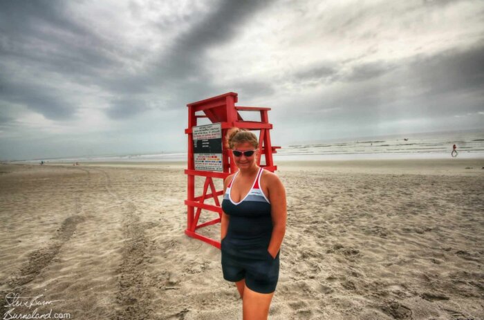 Laura and a red lifeguard chair at Cocoa Beach, Florida