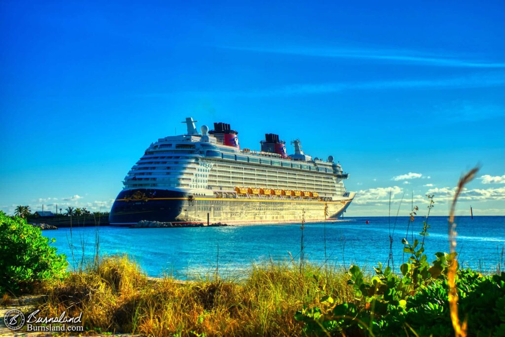 The afternoon sun shines on the Disney Dream, one of the ships of the Disney Cruise Line, as it is docked at the Bahamas island of Castaway Cay.