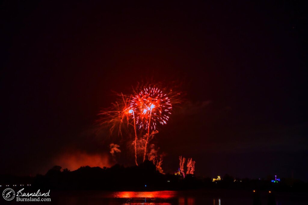 Fireworks explode over the Magic Kingdom at Walt Disney World as seen from across Seven Seas Lagoon at the Polynesian Village Resort