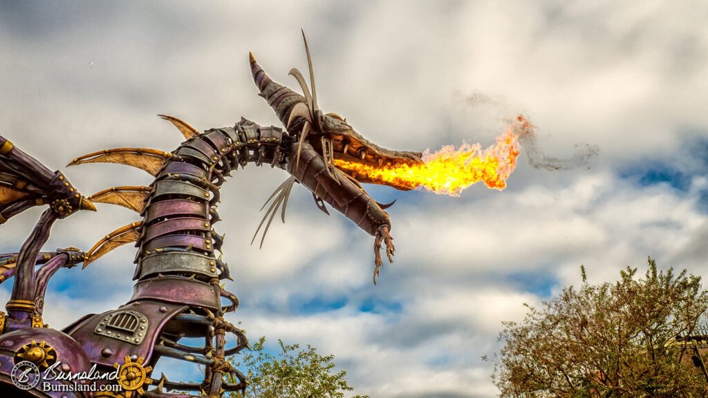 Maleficent breathes fire in the Festival of Fantasy Parade in the Magic Kingdom at Walt Disney World