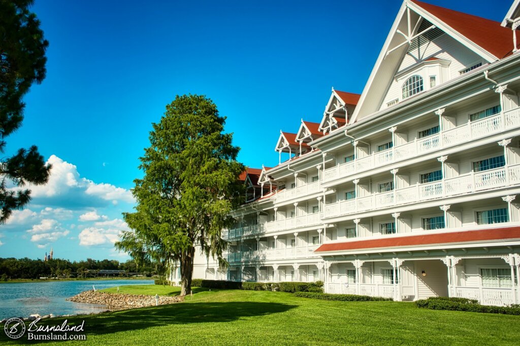 A view of the Grand Floridian Resort at Walt Disney World. Plus, a glimpse of Seven Seas Lagoon, a Monorail, and Cinderella Castle, too.