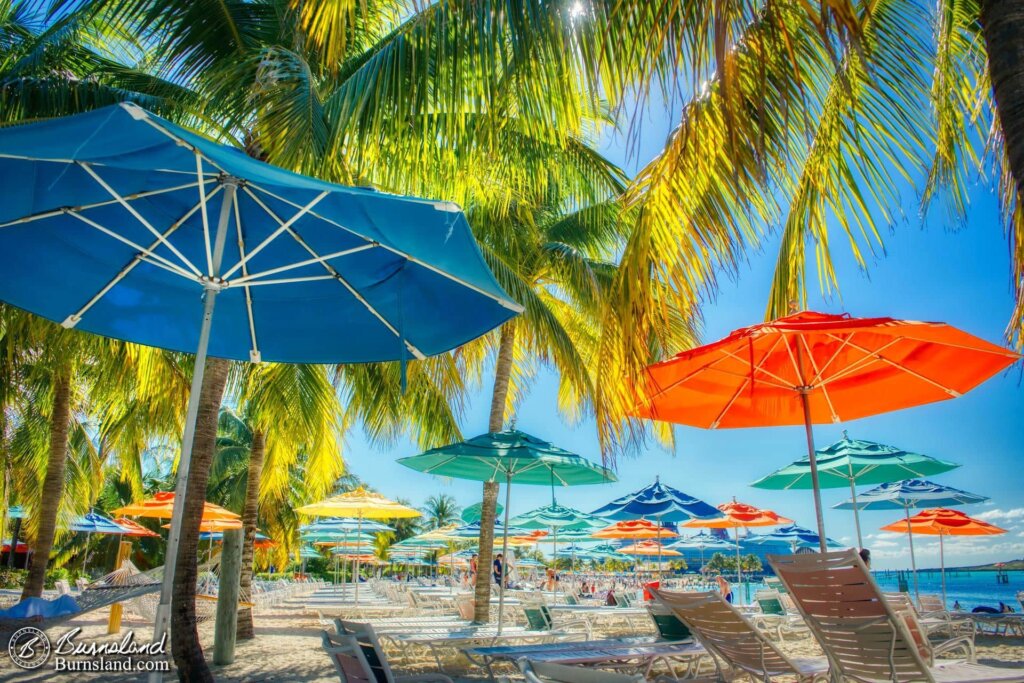 We found a nice spot under the shade of umbrellas and palm trees on the Family Beach at Castaway Cay during our 2018 Christmas Disney Cruise. 