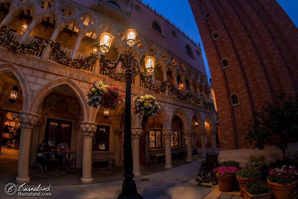 Italy in Epcot’s World Showcase in Walt Disney World glows with light at night.