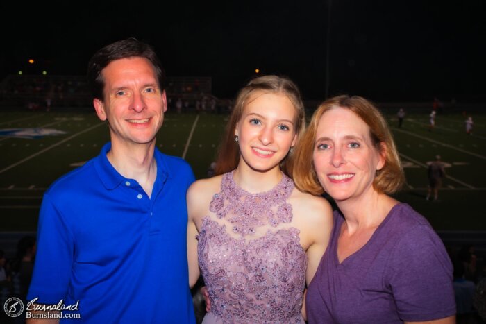 Katie and her parents during the game