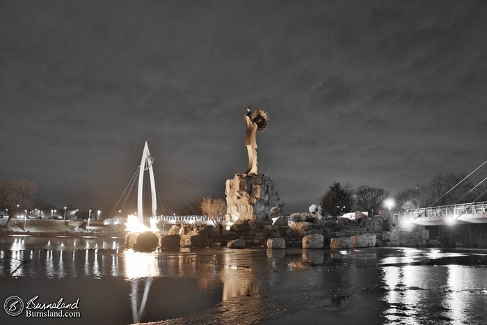 A mostly black and white view of the Keeper of the Plains statue in Wichita, Kansas