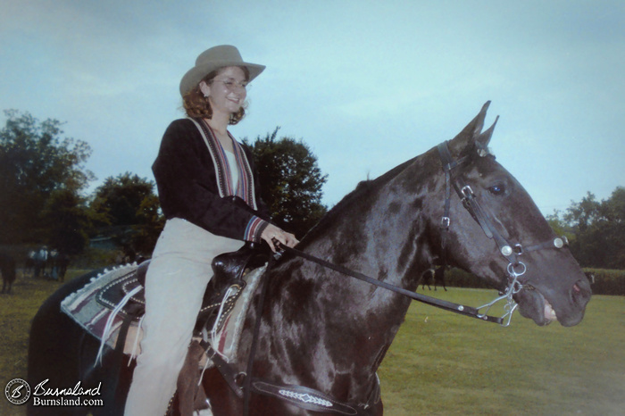 Laura rides Bubba the Wonder Horse in a horse show in this old photo from around 1999. And they are both smiling for the camera!