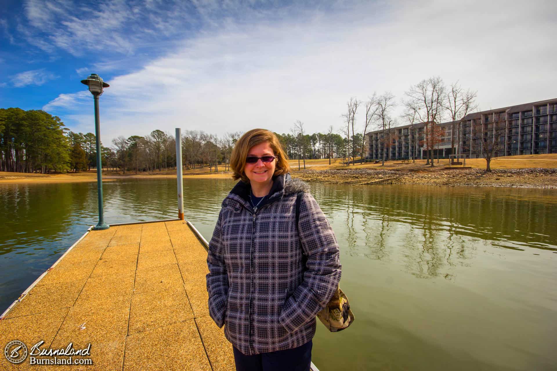 Laura stands on the dock of the Inn at Pickwick Landing State Park on a winter day