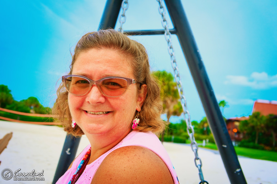 Laura in a swing on the beach at the Polynesian Village Resort at Walt Disney World