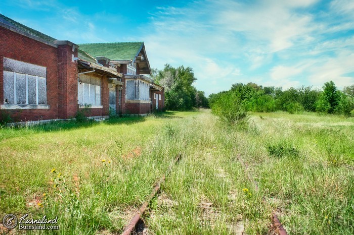 Railroad tracks and the Lyons Railroad Depot in Kansas