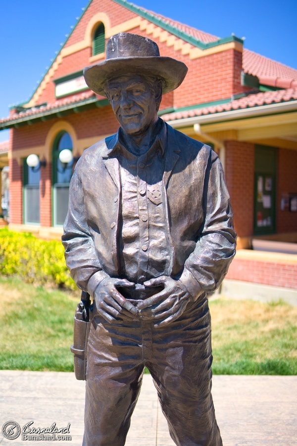 Marshal Matt Dillon watches over the main street of town in Dodge City, Kansas. 