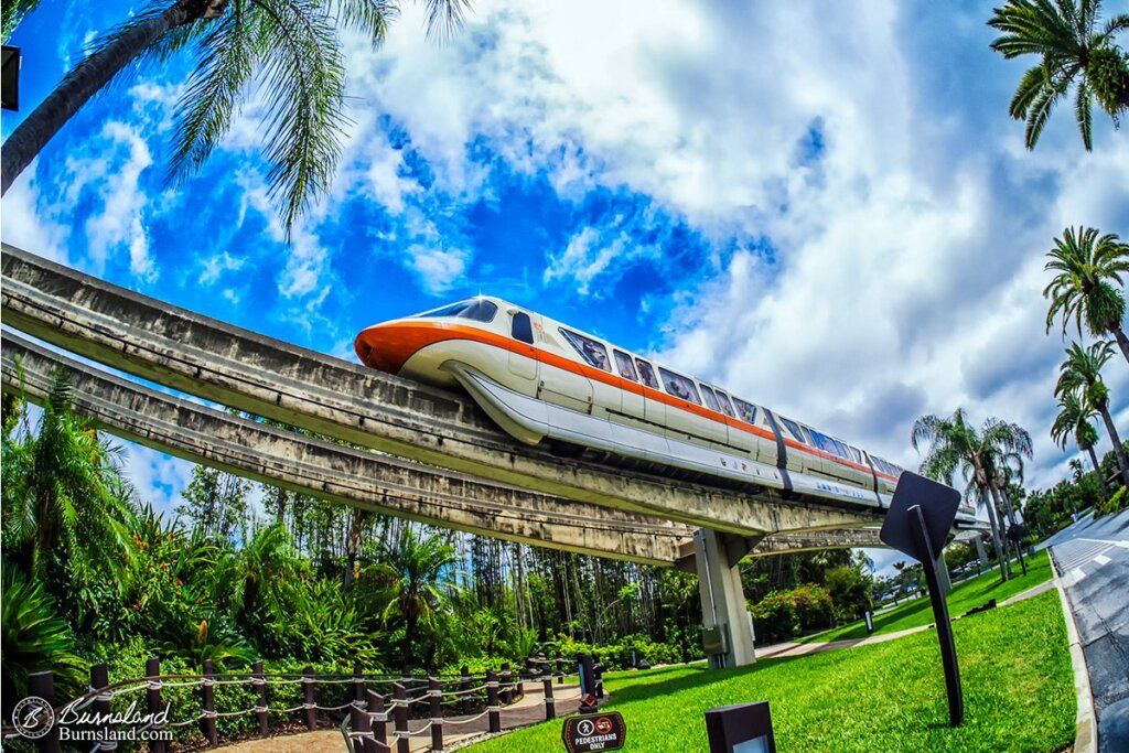 Monorail Orange glides by the Polynesian Village Resort at Walt Disney World in Florida. Read all about it at Burnsland!