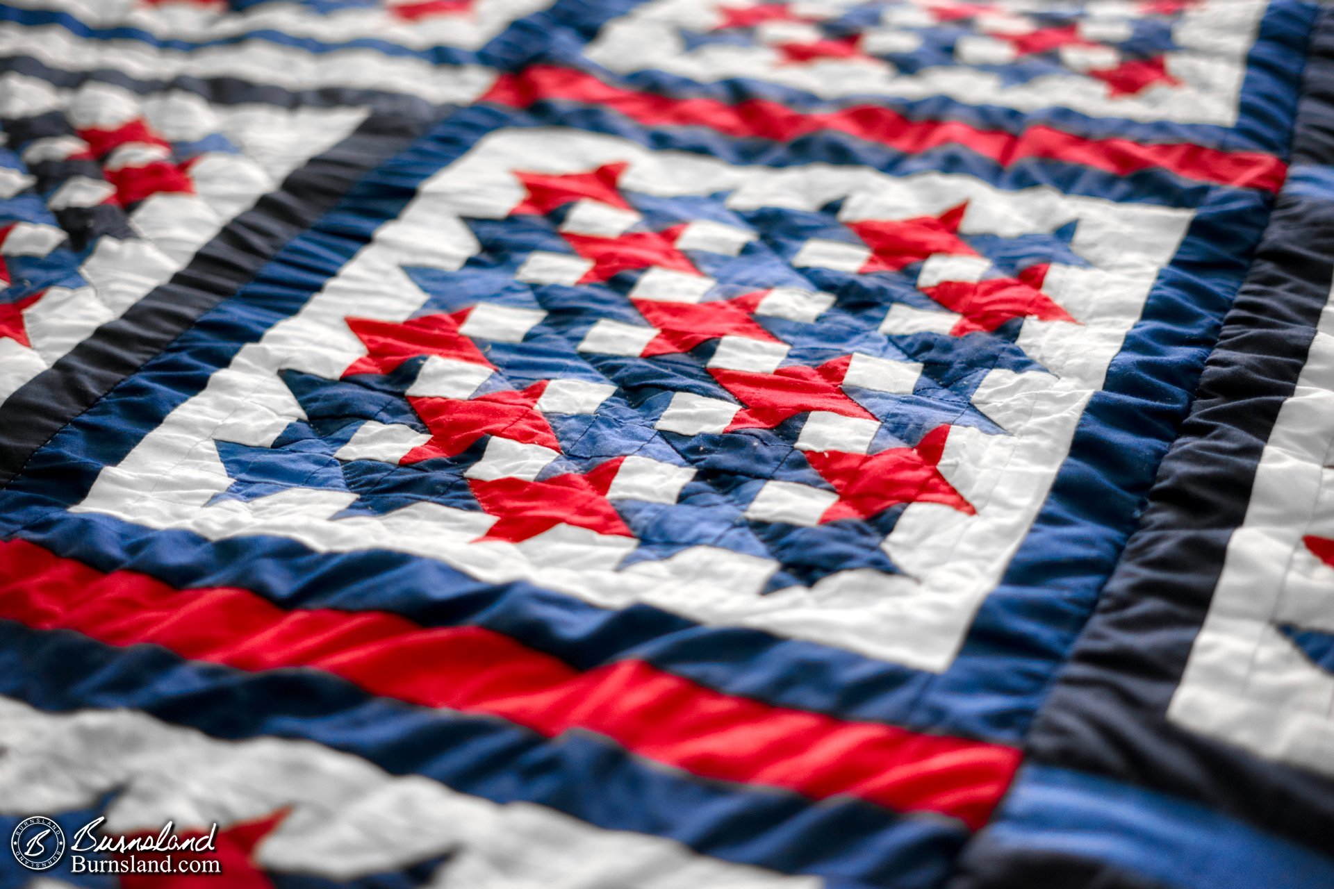 A quilt made by my grandmother is the summer quilt on our bed.