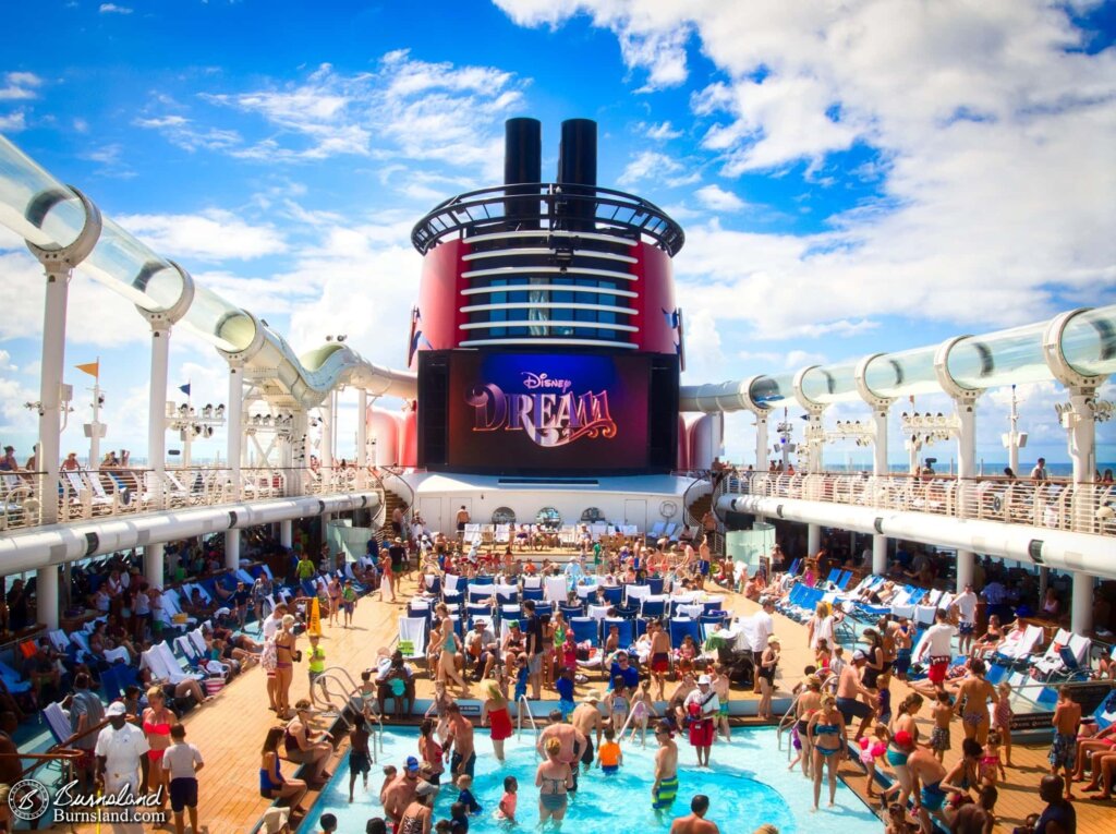 People enjoy the sun, the pools, and the Aquaduck on the pool deck of the Disney Dream, as seen during our 2015 Disney Cruise