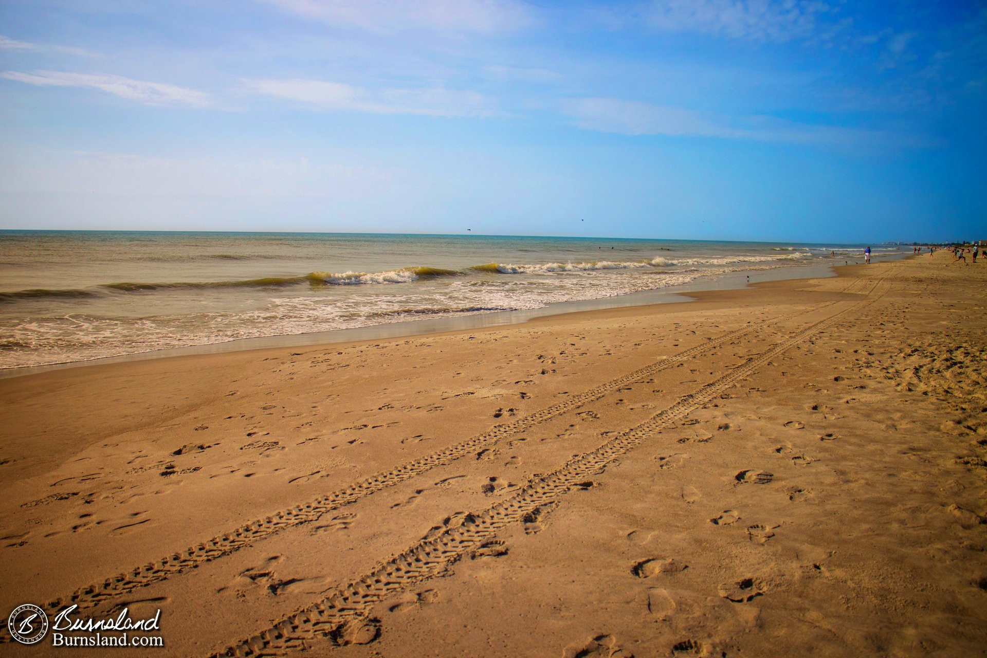 Footprints and tire tracks on Cocoa Beach