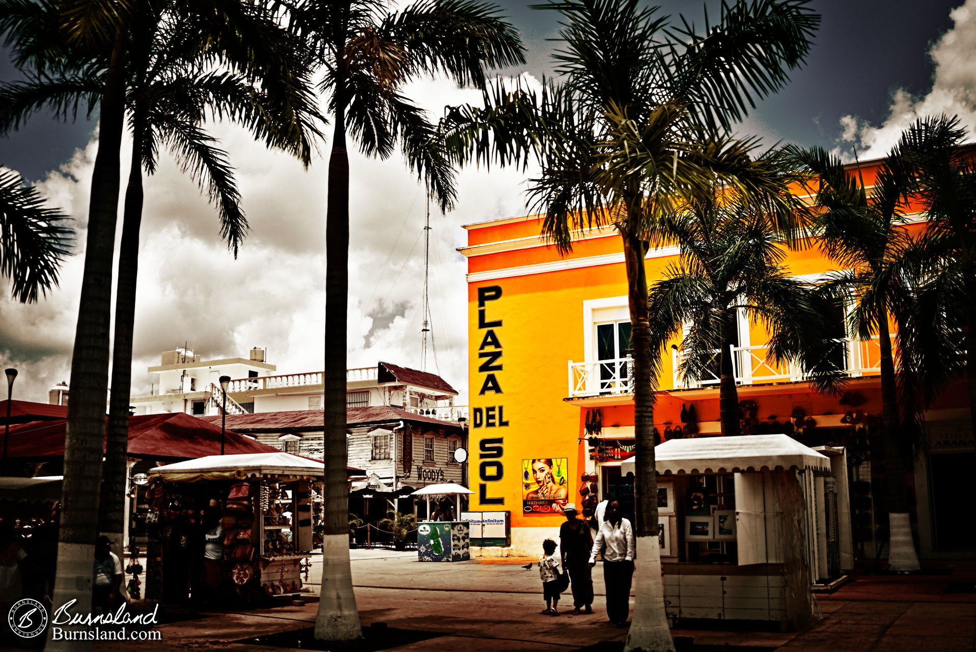 The bright colors of the Plaza del Sol building stand out in the sun at Cozumel in Mexico