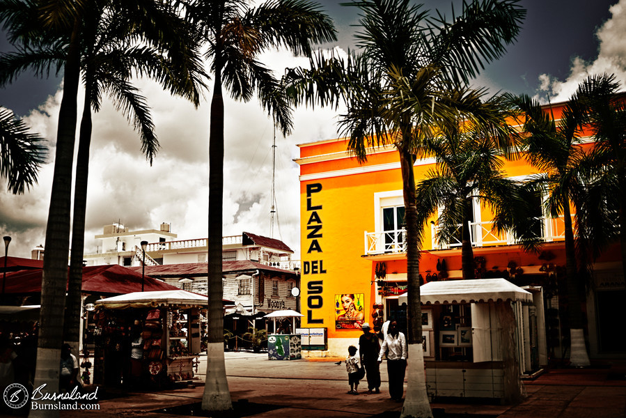 The bright colors of the Plaza del Sol building stand out in the sun at Cozumel in Mexico