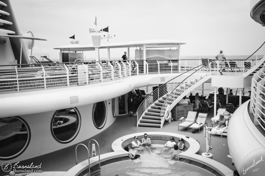 People enjoy the Quiet Cove Pool and the other nearby quiet areas on the Disney Fantasy cruise ship