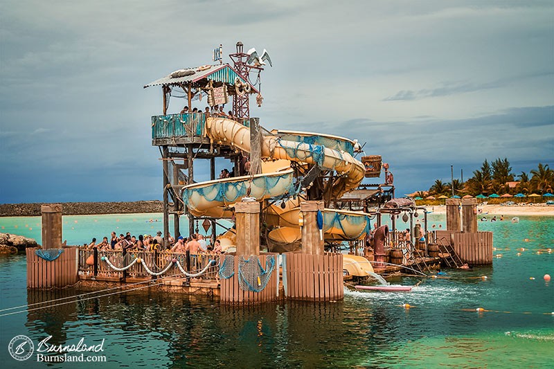 A waterslide “island” offers a fun way to get into the water at Castaway Cay, the private island of the Disney Cruise Line.