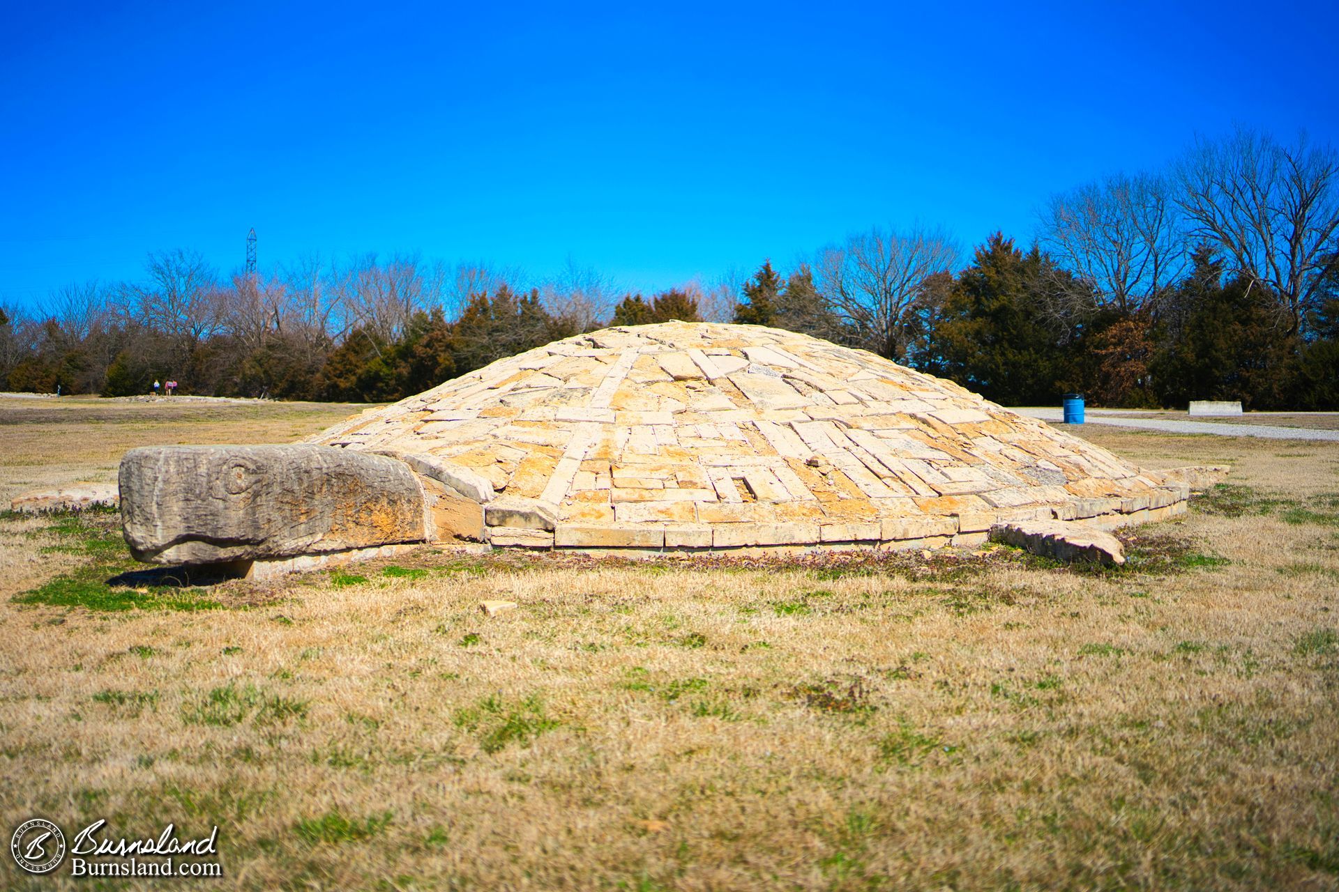 A large stone “Turtle Island” statue by artist Stan Herd in a park in Parsons, Kansas