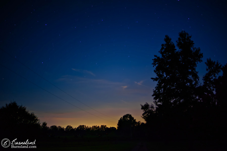 The evening sky is filled with stars, as seen from our front yard one summer night