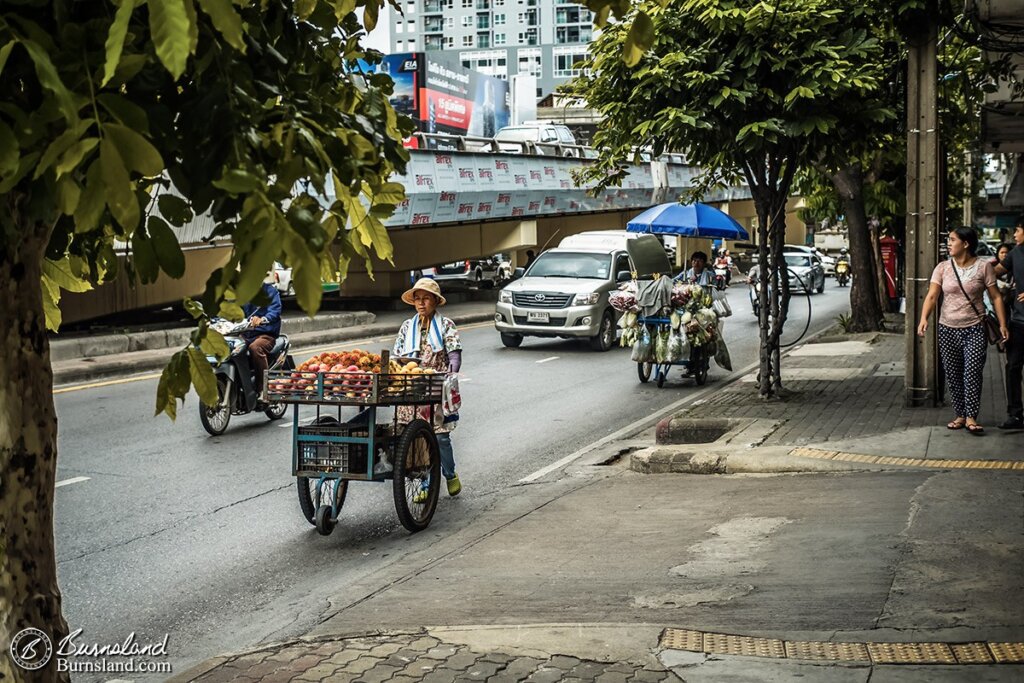 In the morning hours, street vendors roll their carts along the roadway to where they will set up shop for the day in Bangkok, Thailand. Read all about it at Burnsland!