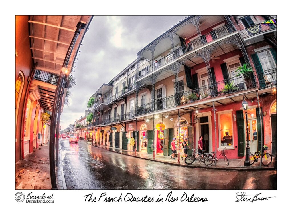 Rain falls in the French Quarter of New Orleans as we wait under an awning for it to pass. Read all about it at Burnsland.