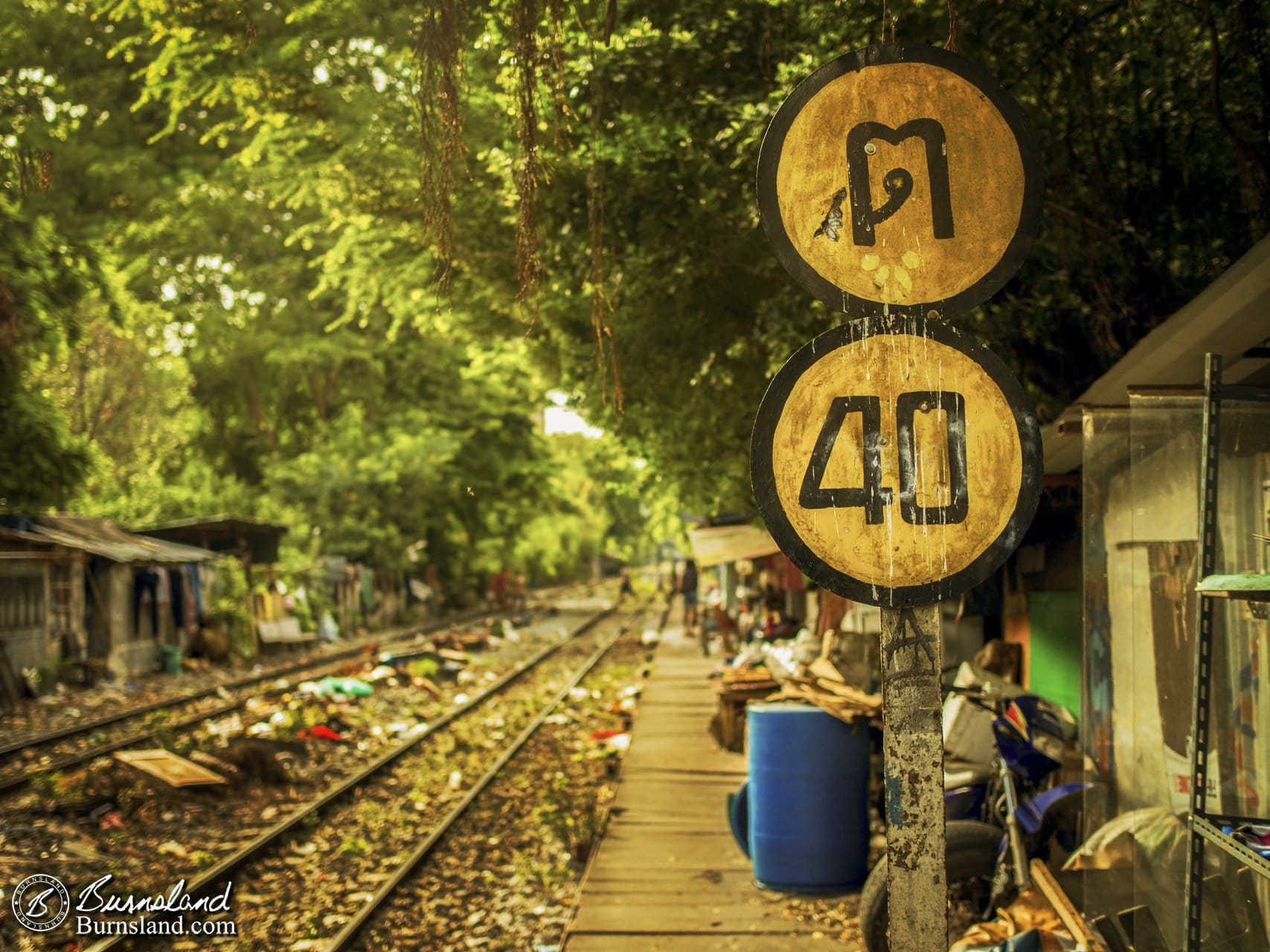 walking beside the railroad tracks in Bangkok