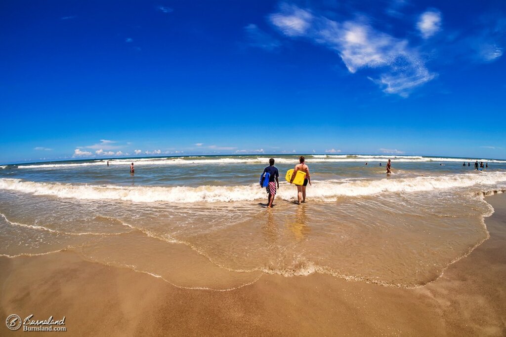 Laura and Jaylin walk out to the waves with their body boards at Cocoa Beach, Florida. Read all about it at Burnsland!