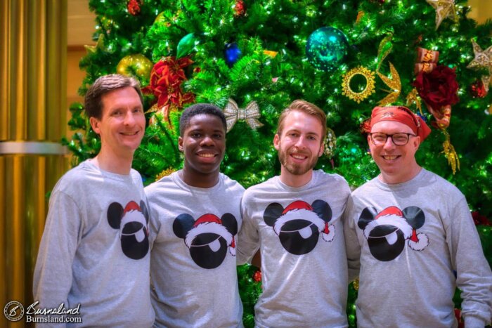 Guys in matching shirts on a Christmas Disney Cruise