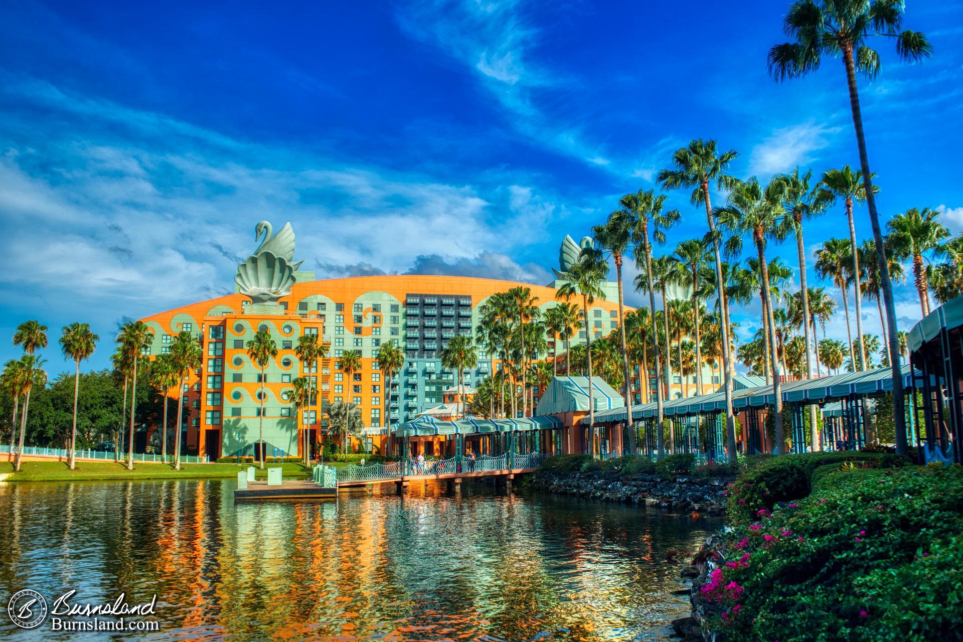 The Walt Disney World Swan hotel is seen across Crescent Lake on a beautiful day