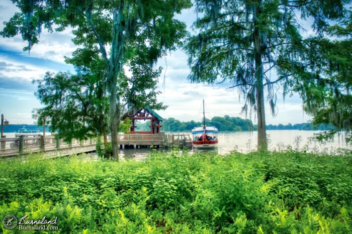 A boat on Bay Lake docks at the Wilderness Lodge at Walt Disney World, as seen through the trees during our 2019 Florida Summer Vacation