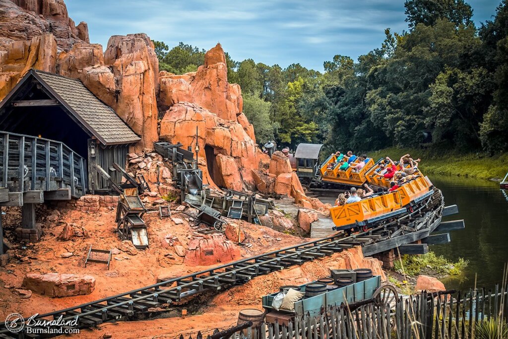 A runaway mine train races around a bend and out over the Rivers of America at Big Thunder Mountain Railroad in Frontierland at Walt Disney World’s Magic Kingdom. Read all about it at Burnsland!