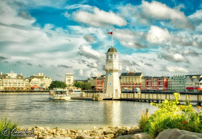 A Friendship boat leaves the dock adjacent to the Lighthouse at the Yacht and Beach Club Resorts at Walt Disney World